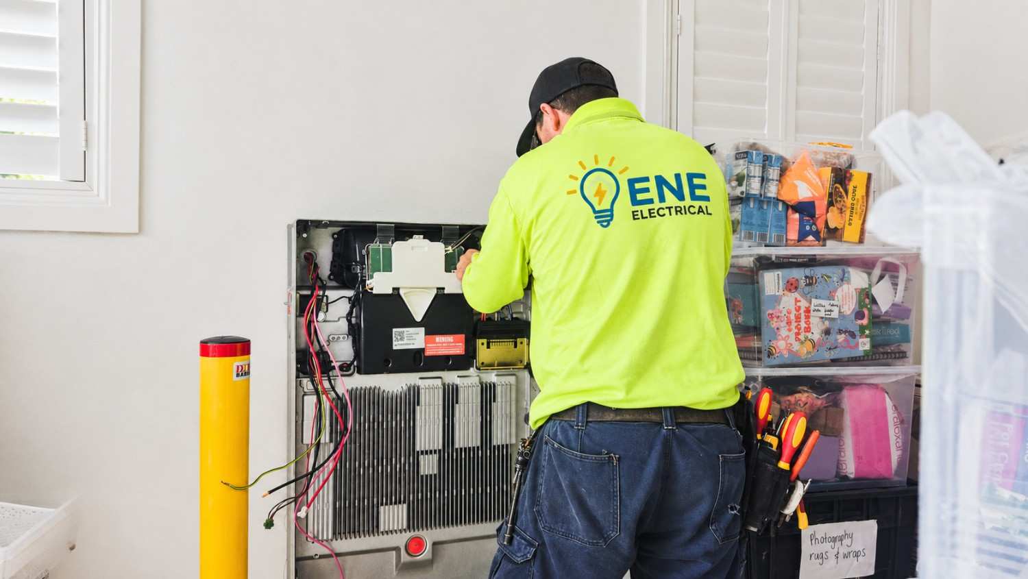 Licensed ENE Electrical technician installing an electrical panel in a new construction home
